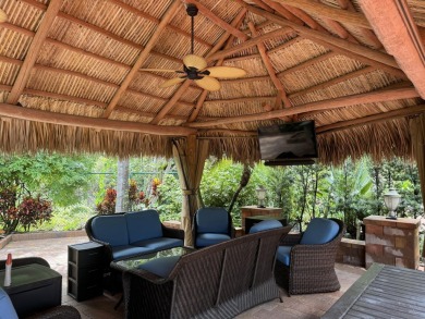 Beautiful landscaped . Large granite bar for wonderful outdoor on St. Lucie Trail Golf Club in Florida - for sale on GolfHomes.com, golf home, golf lot