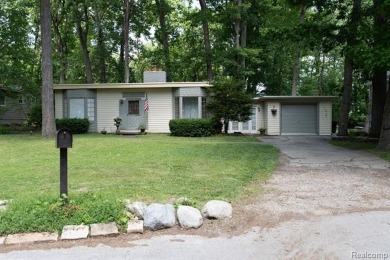 What an amazing opportunity to own an affordable home in on Edgewood Country Club in Michigan - for sale on GolfHomes.com, golf home, golf lot