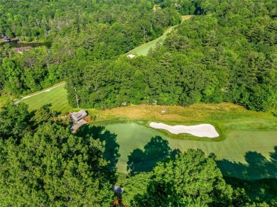 Nestled at the end of a quiet road on .84 private acres, this on Lake Toxaway Country Club in North Carolina - for sale on GolfHomes.com, golf home, golf lot