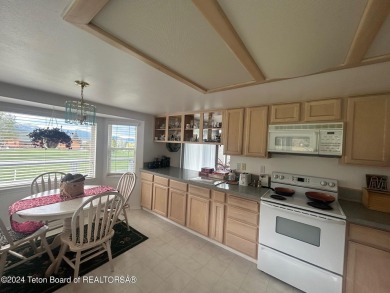 Beautifully landscaped, one-level Golf Course Home in Star on Cedar Creek Golf Course in Wyoming - for sale on GolfHomes.com, golf home, golf lot