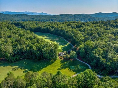 Nestled at the end of a quiet road on .84 private acres, this on Lake Toxaway Country Club in North Carolina - for sale on GolfHomes.com, golf home, golf lot