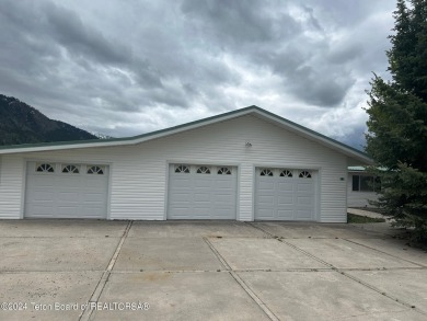 Beautifully landscaped, one-level Golf Course Home in Star on Cedar Creek Golf Course in Wyoming - for sale on GolfHomes.com, golf home, golf lot