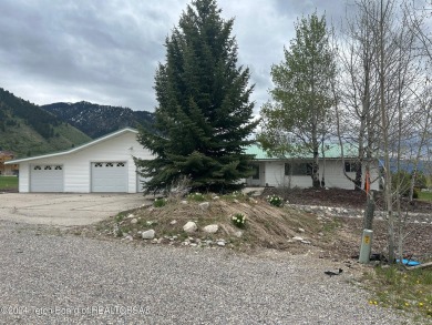 Beautifully landscaped, one-level Golf Course Home in Star on Cedar Creek Golf Course in Wyoming - for sale on GolfHomes.com, golf home, golf lot