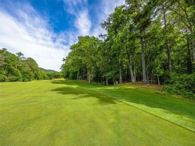 Located off Cherokee Point, this private .915-acre homesite on Lake Toxaway Country Club in North Carolina - for sale on GolfHomes.com, golf home, golf lot