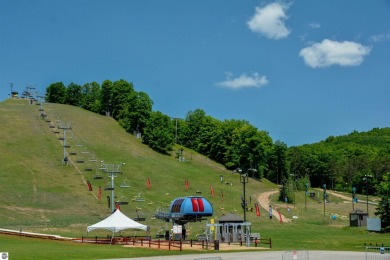 Condo at Crystal Mountain Resort! Golf in the summer, ski in the on Crystal Mountain Golf Course in Michigan - for sale on GolfHomes.com, golf home, golf lot