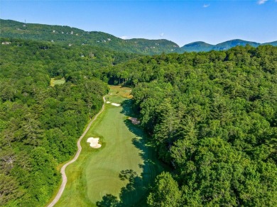 Located off Cherokee Point, this private .915-acre homesite on Lake Toxaway Country Club in North Carolina - for sale on GolfHomes.com, golf home, golf lot
