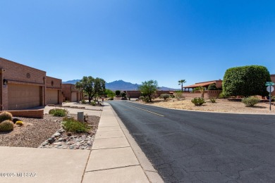 Spacious open-concept living area with stunning mountain views on Canoa Hills Golf Course in Arizona - for sale on GolfHomes.com, golf home, golf lot