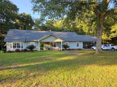 This stunning 5 bedroom, 3 bath home is nestled on 7.5 acres in on Ozark Country Club in Alabama - for sale on GolfHomes.com, golf home, golf lot