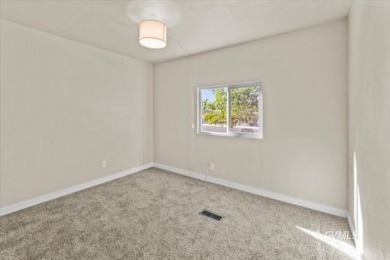 This fully updated, 3-bedroom 2 bath home is move-in ready and on Mt. Graham Municipal Golf Course in Arizona - for sale on GolfHomes.com, golf home, golf lot