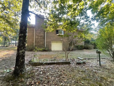 Golf-front brick beauty on a shaded double lot in Indian Hills on Indian Hills Country Club in Arkansas - for sale on GolfHomes.com, golf home, golf lot