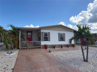 This beautifully updated home in the 55+ waterfront community of on Apollo Beach Golf and Sea Club in Florida - for sale on GolfHomes.com, golf home, golf lot