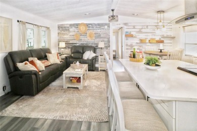 This beautifully updated home in the 55+ waterfront community of on Apollo Beach Golf and Sea Club in Florida - for sale on GolfHomes.com, golf home, golf lot