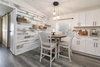 This beautifully updated home in the 55+ waterfront community of on Apollo Beach Golf and Sea Club in Florida - for sale on GolfHomes.com, golf home, golf lot