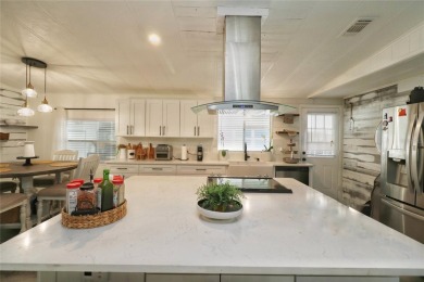 This beautifully updated home in the 55+ waterfront community of on Apollo Beach Golf and Sea Club in Florida - for sale on GolfHomes.com, golf home, golf lot