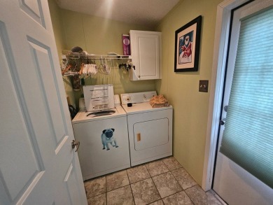 This home is on leased land, meaning buyers do not own the land on Big Cypress Golf and Country Club in Florida - for sale on GolfHomes.com, golf home, golf lot