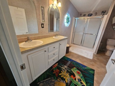 This home is on leased land, meaning buyers do not own the land on Big Cypress Golf and Country Club in Florida - for sale on GolfHomes.com, golf home, golf lot