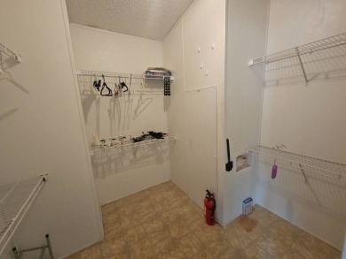 This home is on leased land, meaning buyers do not own the land on Big Cypress Golf and Country Club in Florida - for sale on GolfHomes.com, golf home, golf lot