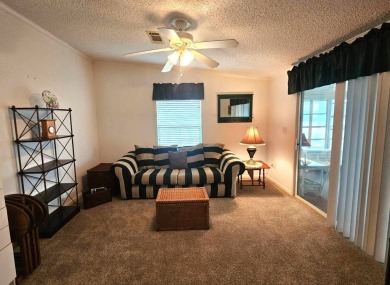 This home is on leased land, meaning buyers do not own the land on Big Cypress Golf and Country Club in Florida - for sale on GolfHomes.com, golf home, golf lot