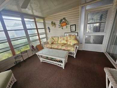 This home is on leased land, meaning buyers do not own the land on Big Cypress Golf and Country Club in Florida - for sale on GolfHomes.com, golf home, golf lot