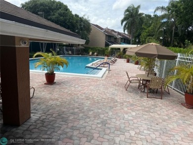 Well maintained and very spacious 3/2.5 townhome in Woodmont on  in Florida - for sale on GolfHomes.com, golf home, golf lot