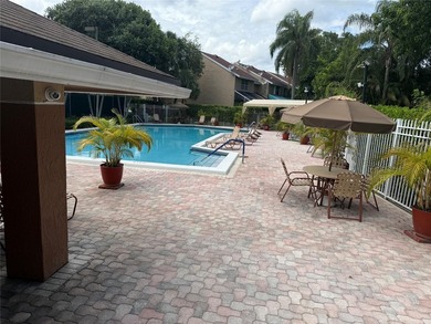 Well maintained and very spacious 3/2.5 townhome in Woodmont on  in Florida - for sale on GolfHomes.com, golf home, golf lot