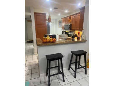 Well maintained and very spacious 3/2.5 townhome in Woodmont on  in Florida - for sale on GolfHomes.com, golf home, golf lot