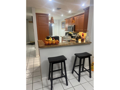 Well maintained and very spacious 3/2.5 townhome in Woodmont on  in Florida - for sale on GolfHomes.com, golf home, golf lot