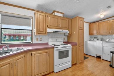 Located in the desirable Fox Run 55+ community, this on Bay Tree Golf Course in Florida - for sale on GolfHomes.com, golf home, golf lot