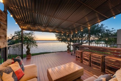 Stunning WATERFRONT townhome in a Mediterranean Style, gated on Lakeside Village Golf Course in Texas - for sale on GolfHomes.com, golf home, golf lot
