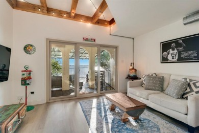 Stunning WATERFRONT townhome in a Mediterranean Style, gated on Lakeside Village Golf Course in Texas - for sale on GolfHomes.com, golf home, golf lot