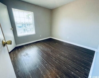 Two Bedroom, one and one half bath unit across the street from on The Hackler Course at Coastal Carolina University in South Carolina - for sale on GolfHomes.com, golf home, golf lot