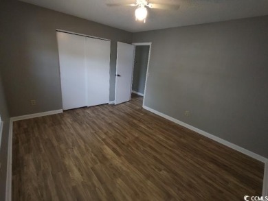 Two Bedroom, one and one half bath unit across the street from on The Hackler Course at Coastal Carolina University in South Carolina - for sale on GolfHomes.com, golf home, golf lot