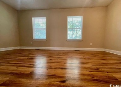 Two Bedroom, one and one half bath unit across the street from on The Hackler Course at Coastal Carolina University in South Carolina - for sale on GolfHomes.com, golf home, golf lot