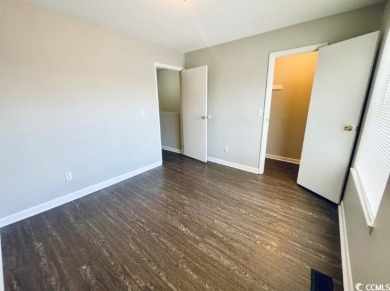 Two Bedroom, one and one half bath unit across the street from on The Hackler Course at Coastal Carolina University in South Carolina - for sale on GolfHomes.com, golf home, golf lot