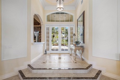 Located on over 1/2 acre, this custom 4 bed, 4 bath estate on Old Marsh Golf Club in Florida - for sale on GolfHomes.com, golf home, golf lot