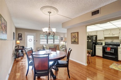 Welcome to your new home in the beautiful community of Wynmoor! on Wynmoor Golf Course in Florida - for sale on GolfHomes.com, golf home, golf lot