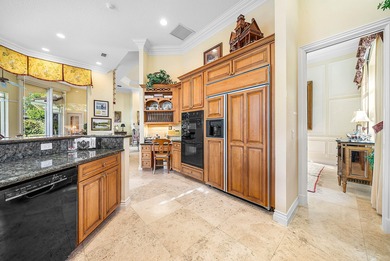 Located on over 1/2 acre, this custom 4 bed, 4 bath estate on Old Marsh Golf Club in Florida - for sale on GolfHomes.com, golf home, golf lot