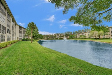 Welcome to your new home in the beautiful community of Wynmoor! on Wynmoor Golf Course in Florida - for sale on GolfHomes.com, golf home, golf lot