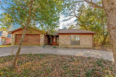 The home is on a quiet street and a quick walk to the Third Lake on Hide-A-Way Lake Golf Course in Texas - for sale on GolfHomes.com, golf home, golf lot