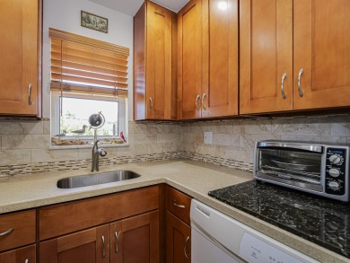 Completely redone with tile floors throughout, updated kitchen on Monterey Yacht and Country Club in Florida - for sale on GolfHomes.com, golf home, golf lot