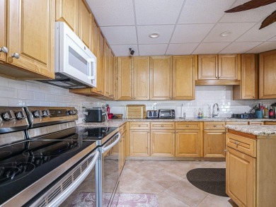 Completely redone with tile floors throughout, updated kitchen on Monterey Yacht and Country Club in Florida - for sale on GolfHomes.com, golf home, golf lot
