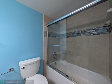 Beautifully updated and furnished, large 2 bedroom condominium on Palm-Aire Country Club and Resort - The Oaks in Florida - for sale on GolfHomes.com, golf home, golf lot