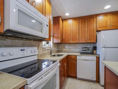 Completely redone with tile floors throughout, updated kitchen on Monterey Yacht and Country Club in Florida - for sale on GolfHomes.com, golf home, golf lot