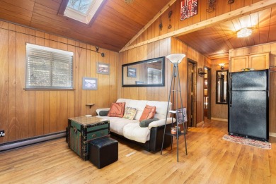 A charming cabin in the woods, move in ready, with 2 bedrooms, 1 on Hide-A-Way Hills Golf Club in Ohio - for sale on GolfHomes.com, golf home, golf lot