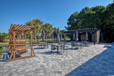 Welcome home to true Southern charm in the heart of Murrells on International Club of Myrtle Beach in South Carolina - for sale on GolfHomes.com, golf home, golf lot