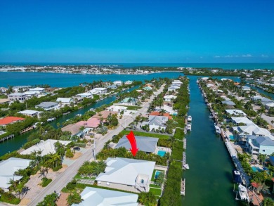 180 13th St, Key Colony Beach. Luxury waterfront living meets on Key Colony Beach Golf Course in Florida - for sale on GolfHomes.com, golf home, golf lot