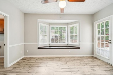Welcome to this beautiful brick front home nestled on a sweeping on Hidden Hills Country Club in Georgia - for sale on GolfHomes.com, golf home, golf lot