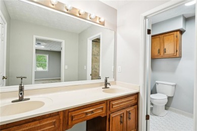 Welcome to this beautiful brick front home nestled on a sweeping on Hidden Hills Country Club in Georgia - for sale on GolfHomes.com, golf home, golf lot