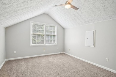 Welcome to this beautiful brick front home nestled on a sweeping on Hidden Hills Country Club in Georgia - for sale on GolfHomes.com, golf home, golf lot