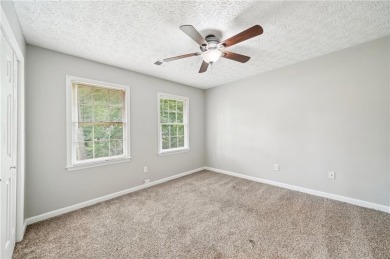 Welcome to this beautiful brick front home nestled on a sweeping on Hidden Hills Country Club in Georgia - for sale on GolfHomes.com, golf home, golf lot